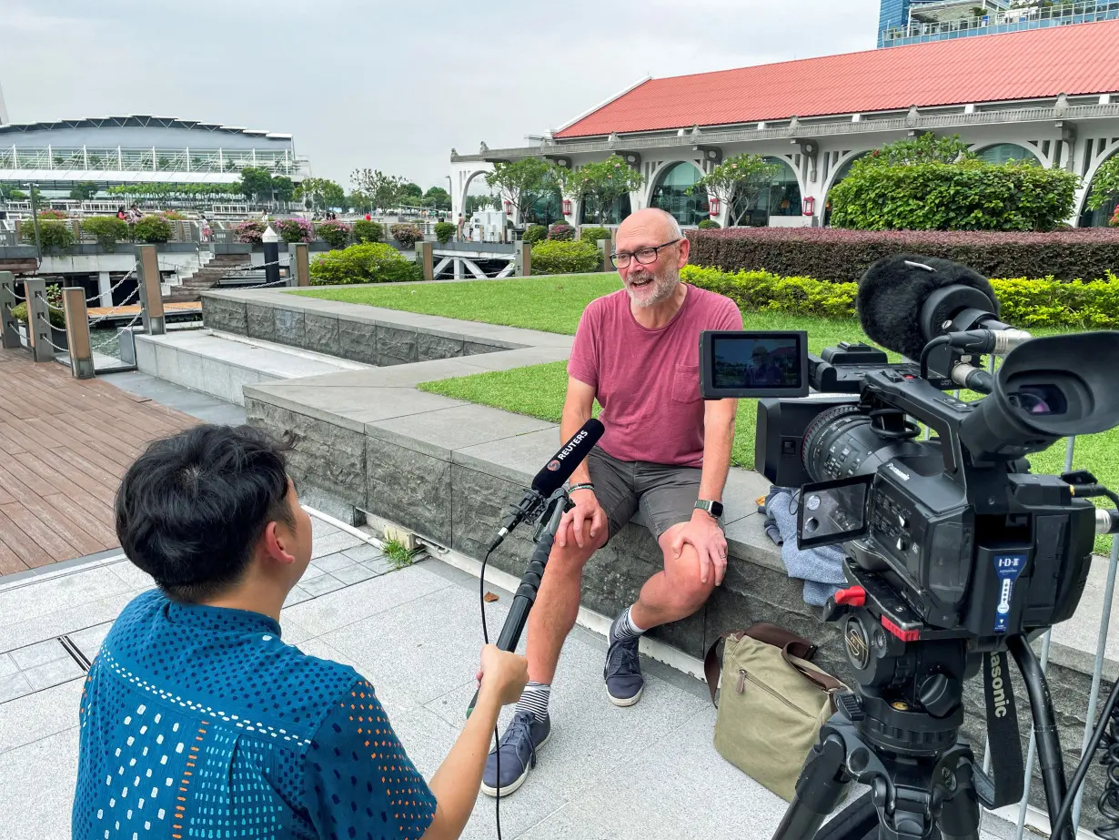 British citizen Davies, a passenger on the Singapore Airlines flight SQ321, attends an interview with Reuters in Singapore