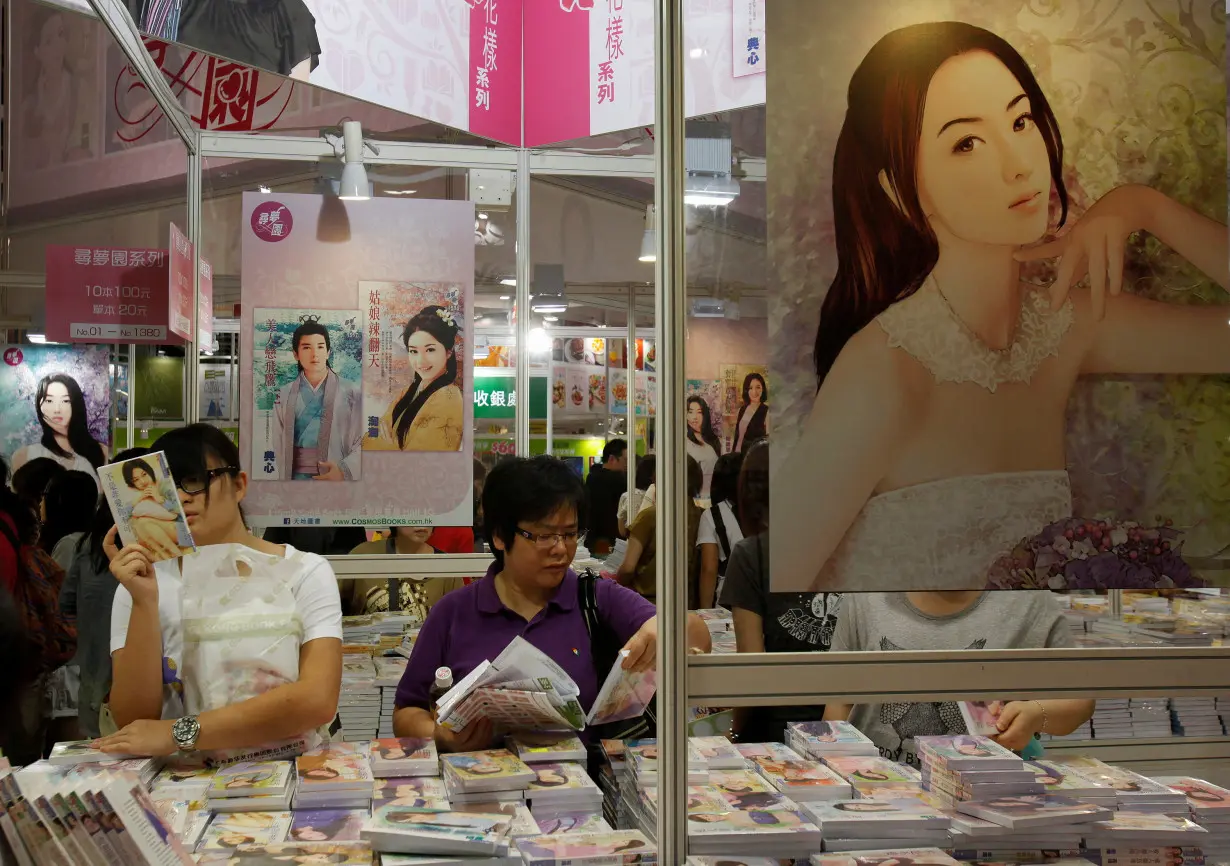 FILE PHOTO: Book lovers select romance novels in Hong Kong