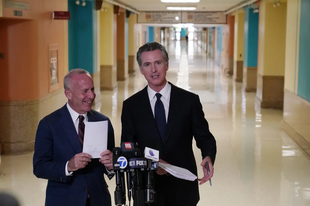 California governor signs 2 major proposals for mental health reform to go before voters in 2024