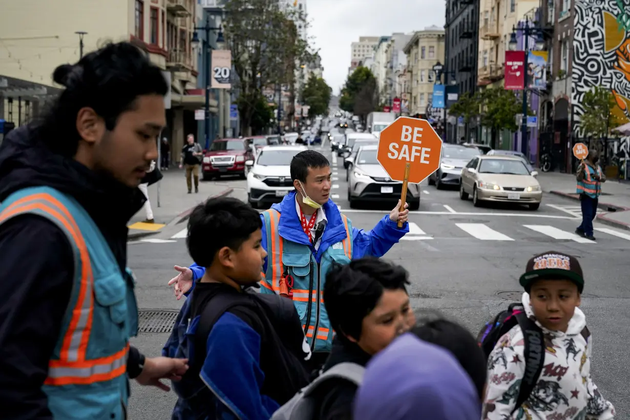 With a vest and a voice, helpers escort kids through San Francisco’s broken Tenderloin streets