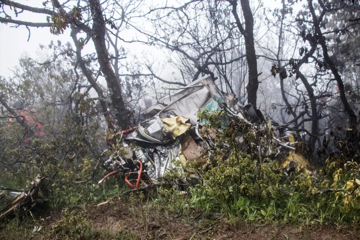 Rescue team works following a crash of a helicopter carrying Iran's President Ebrahim Raisi, in Varzaqan