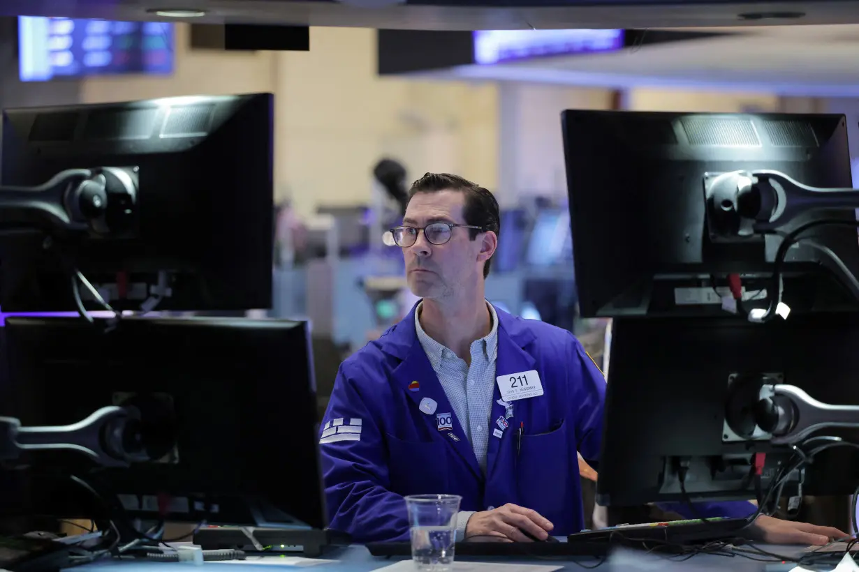 A trader works on the trading floor at the New York Stock Exchange (NYSE) in New York City