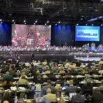 United Methodist delegates repeal their church’s ban on its clergy celebrating same-sex marriages
