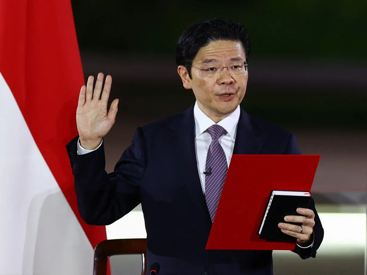 Singapore's Deputy Prime Minister and Minister of Finance Lawrence Wong is sworn in as Singapore's fourth Prime Minister