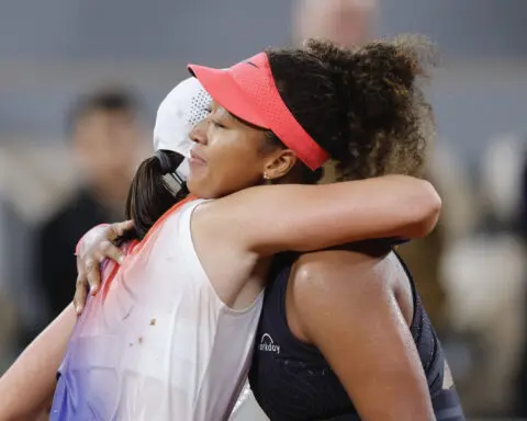Iga Swiatek saves a match point and comes back to beat Naomi Osaka at the French Open