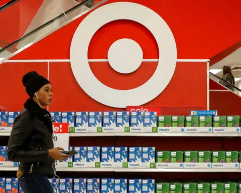 Target issues weak forecast as shoppers pull back; shares tumble