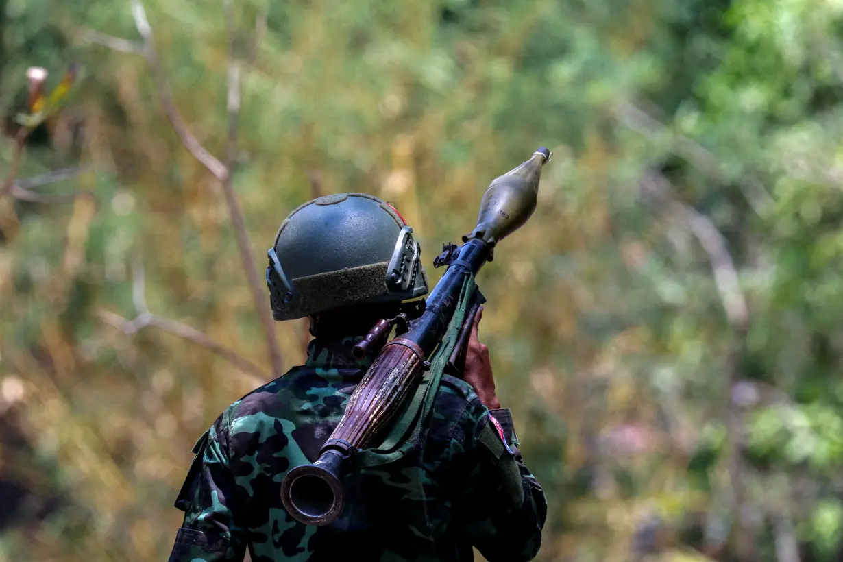 FILE PHOTO: A soldier from the Karen National Liberation Army (KNLA) carries an RPG launcher at a Myanmar military base at Thingyan Nyi Naung village on the outskirts of Myawaddy