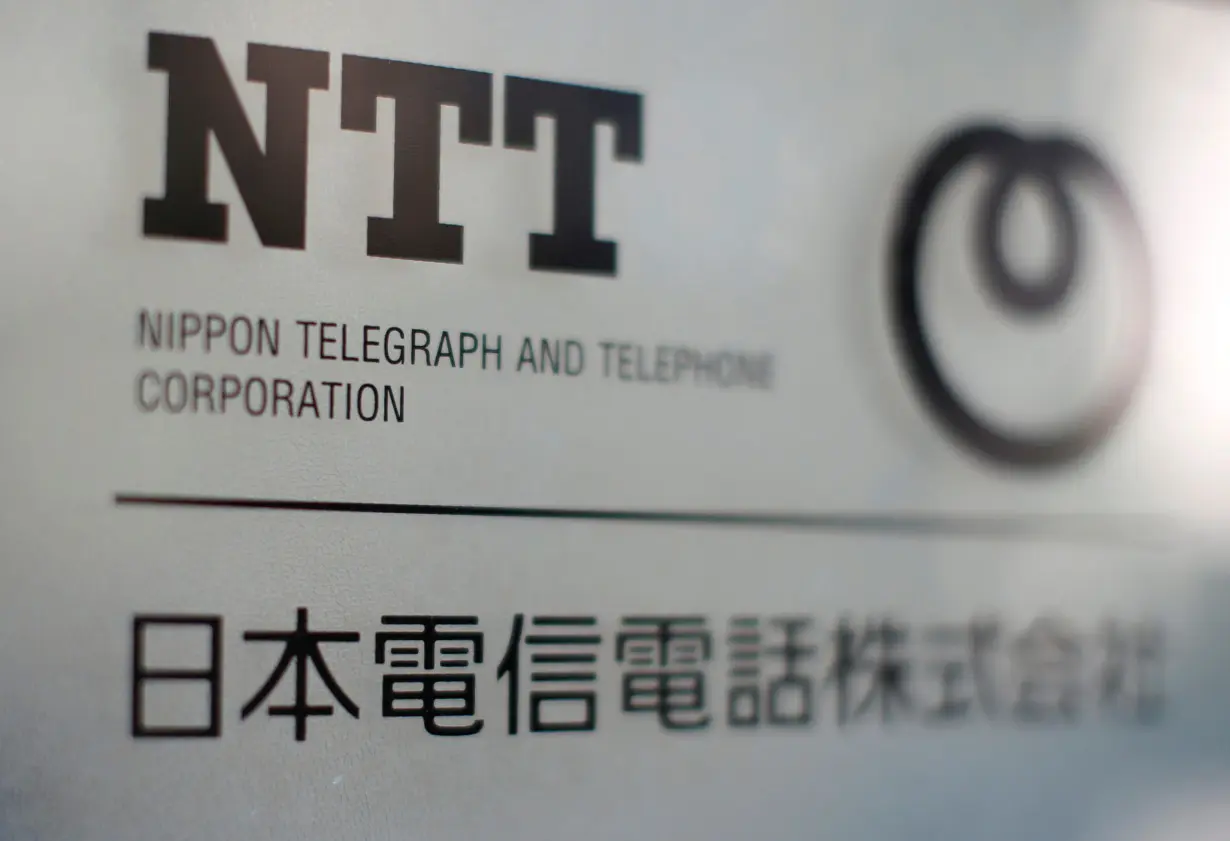 The logo of NTT is displayed at the company office in Tokyo