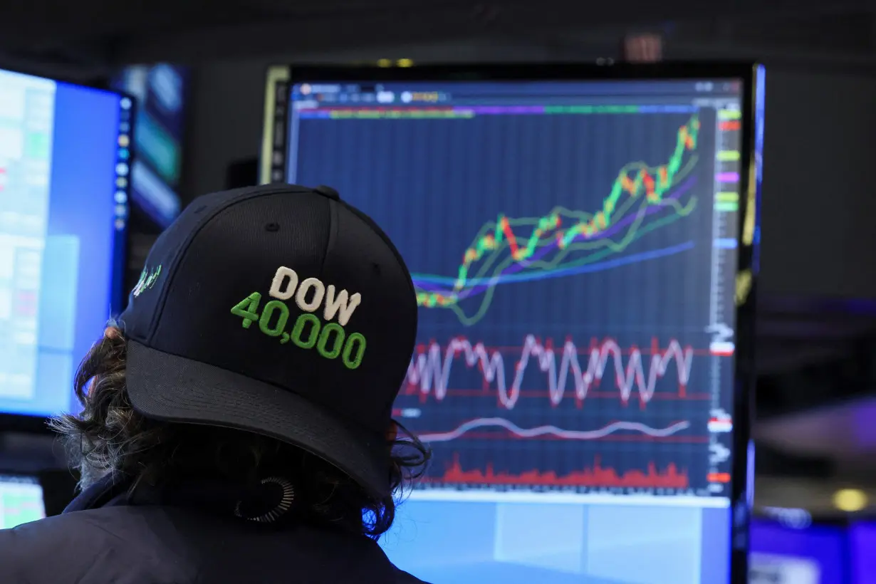 Traders work on the floor at the New York Stock Exchange (NYSE) in New York City