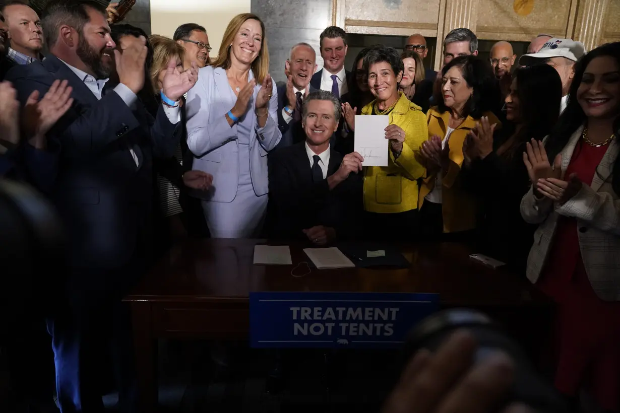 California governor signs 2 major proposals for mental health reform to go before voters in 2024