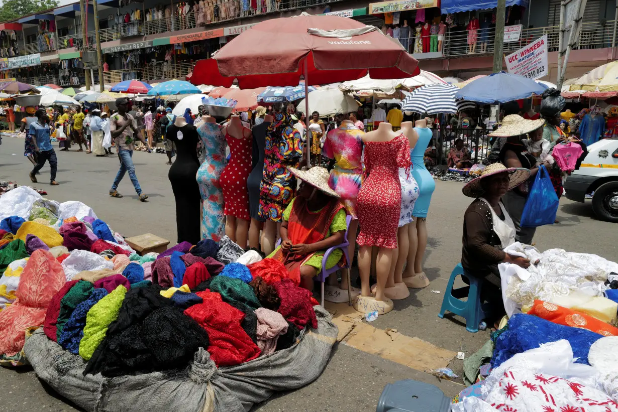 FILE PHOTO: People trade in Accra