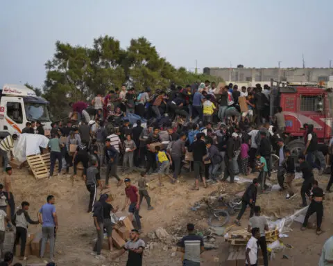 More aid getting from US pier to people in Gaza, officials say, after troubled launch