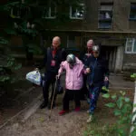 Ukrainian rescuers evacuate elderly and infirm as Russians close in