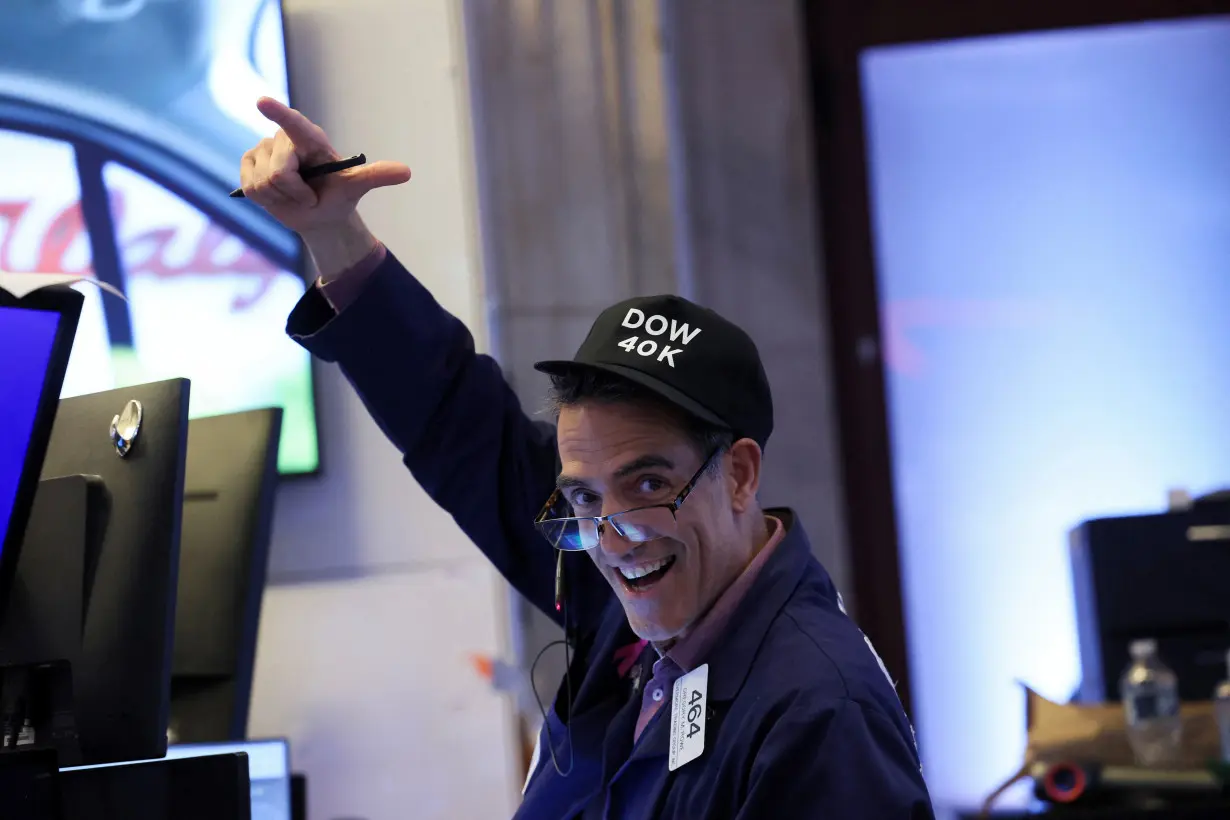 Traders work on the floor at the New York Stock Exchange (NYSE) in New York City