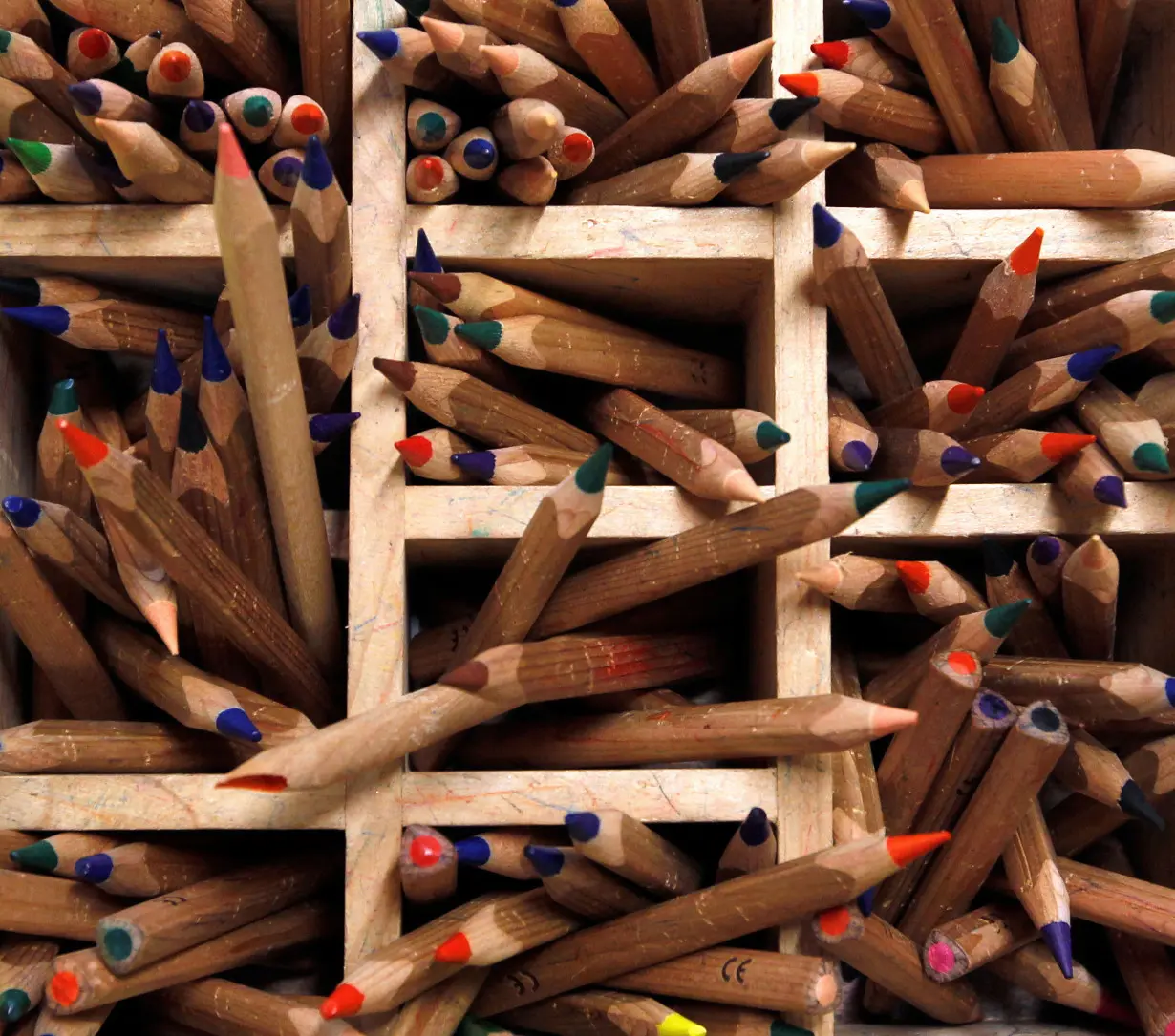 FILE PHOTO: Coloured pencils are pictured in a wooden box at a nursery school in Eichenau