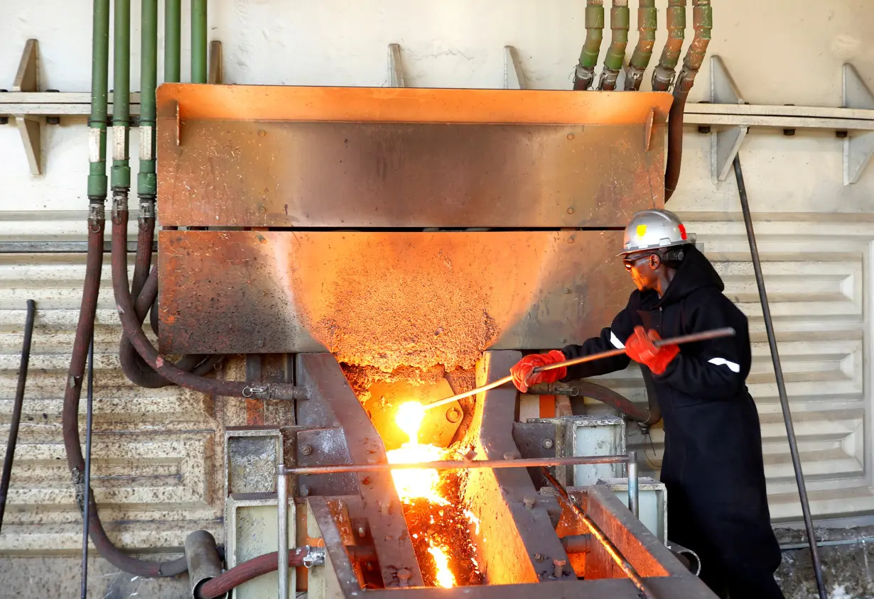 A worker attends to machinery at a smelter plant at Anglo American Platinum's Unki mine in Shurugwi