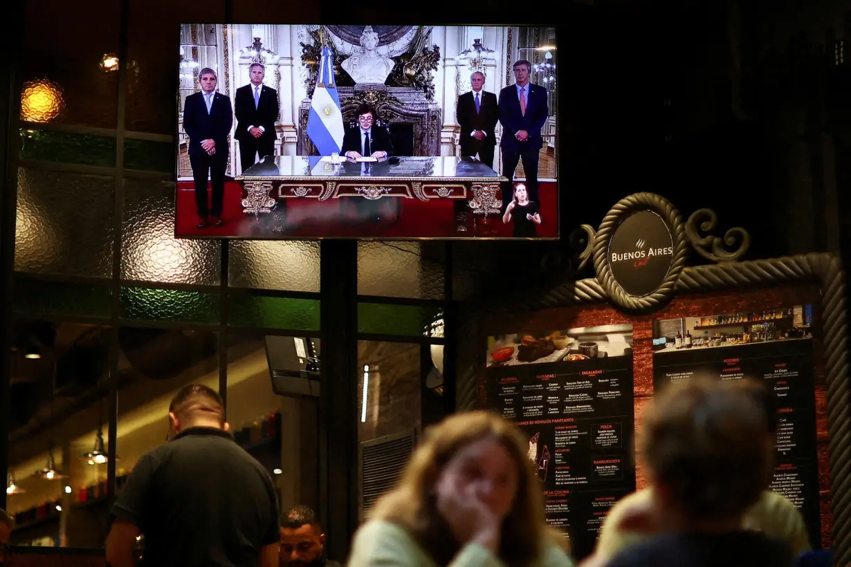 FILE PHOTO: Argentina's President Javier Milei addresses to the people on national TV, in Buenos Aires