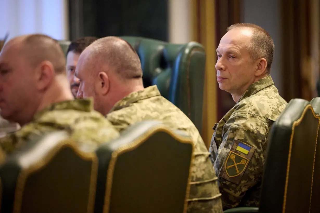 FILE PHOTO: Ukraine's President Zelenskiy attends a meeting with newly appointed top military commanders in Kyiv