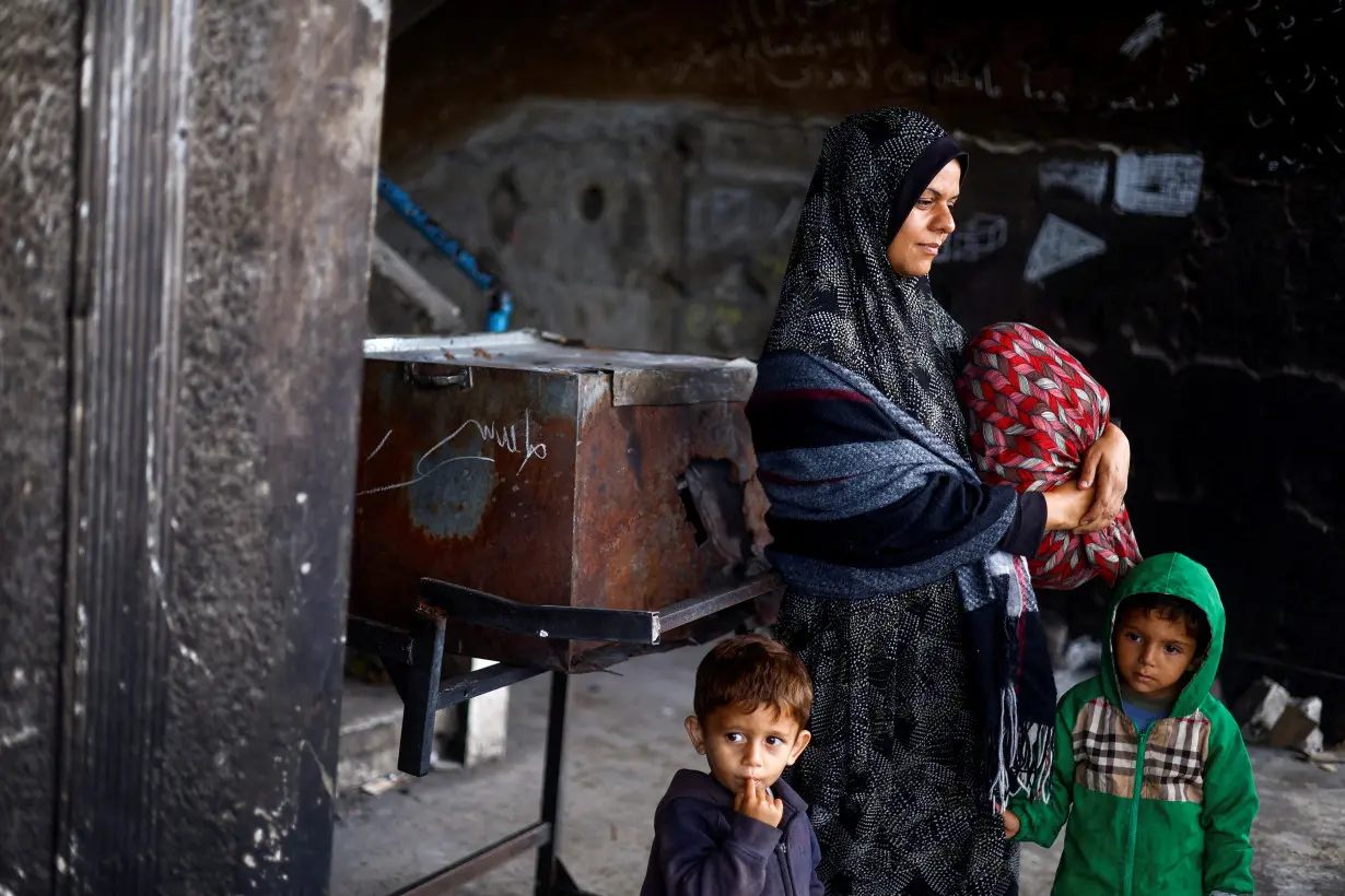 Palestinians prepare to flee Rafah after Israeli forces launched a ground and air operation in the eastern part of the city