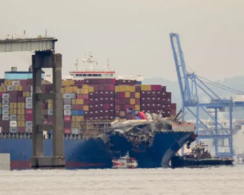 Tugboats escort ship that caused deadly Baltimore bridge collapse back to port