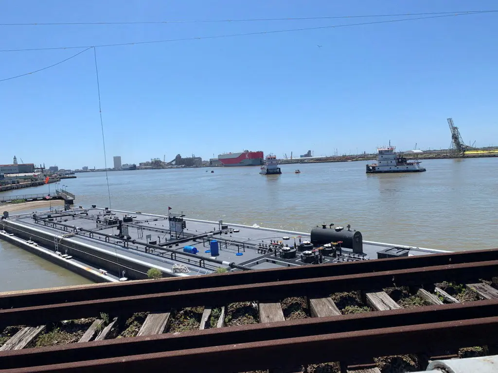 A barge that crashed into a bridge, forcing the closure of a roadway, is seen in Galveston