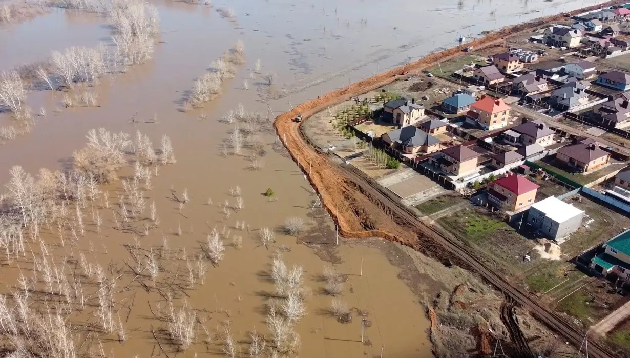 FILE PHOTO: Russian villagers build homemade dam to keep out floods, in Orenburg region