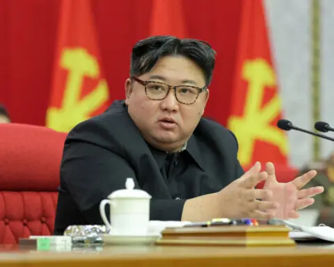 North Korea displays leader's portrait beside predecessors for first time
