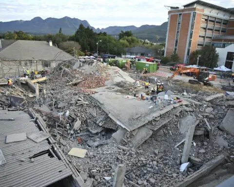 Death toll up to 32 in South Africa building collapse but rescue efforts boosted by 1 more survivor