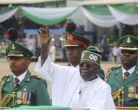 Nigeria's new anthem, written by a Briton, sparks criticism after a contentious law is passed