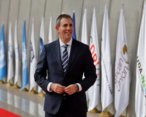 Australia's treasurer says MidEast tensions compound worries about global economy