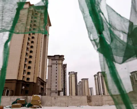 China property shares jump on report of government plans to buy unsold homes