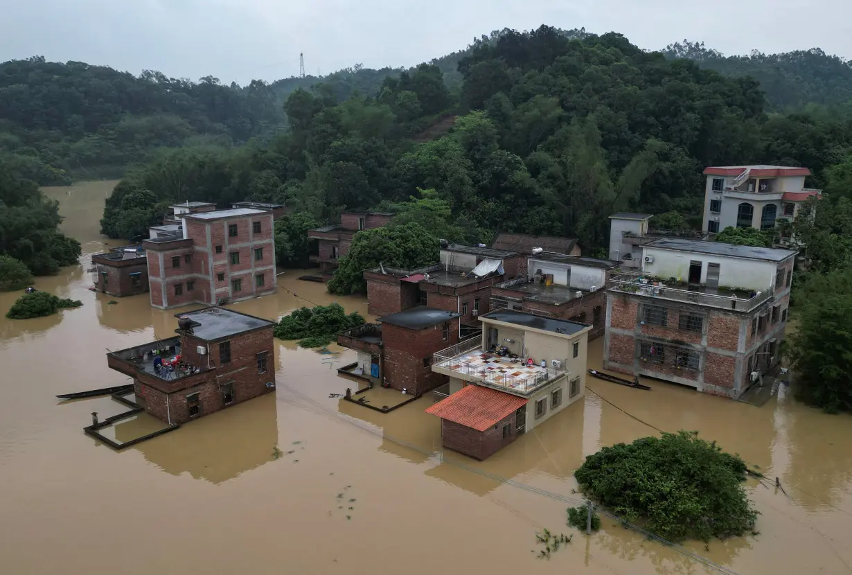 Drone view shows houses submerged in floodwaters following heavy rainfall, at a village in Qingyuan