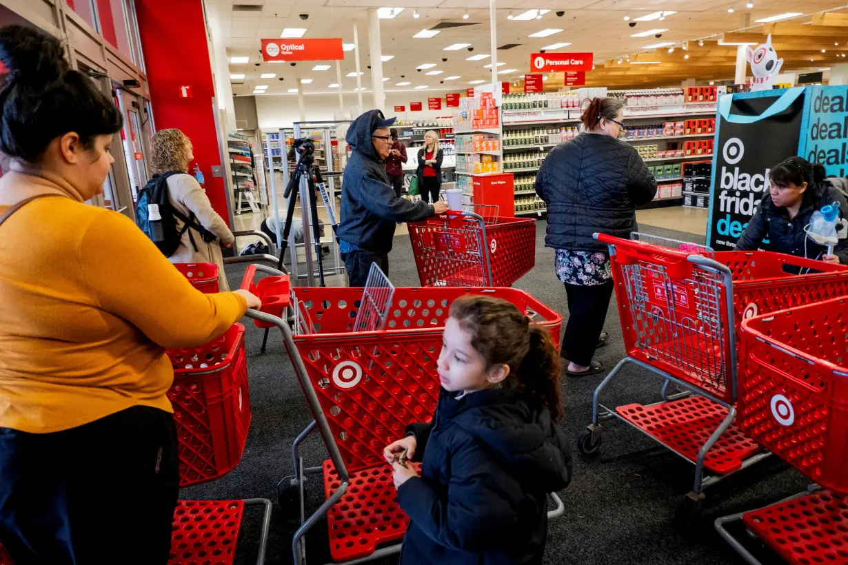 FILE PHOTO: Shoppers converge in a Target store ahead of the Thanksgiving holiday