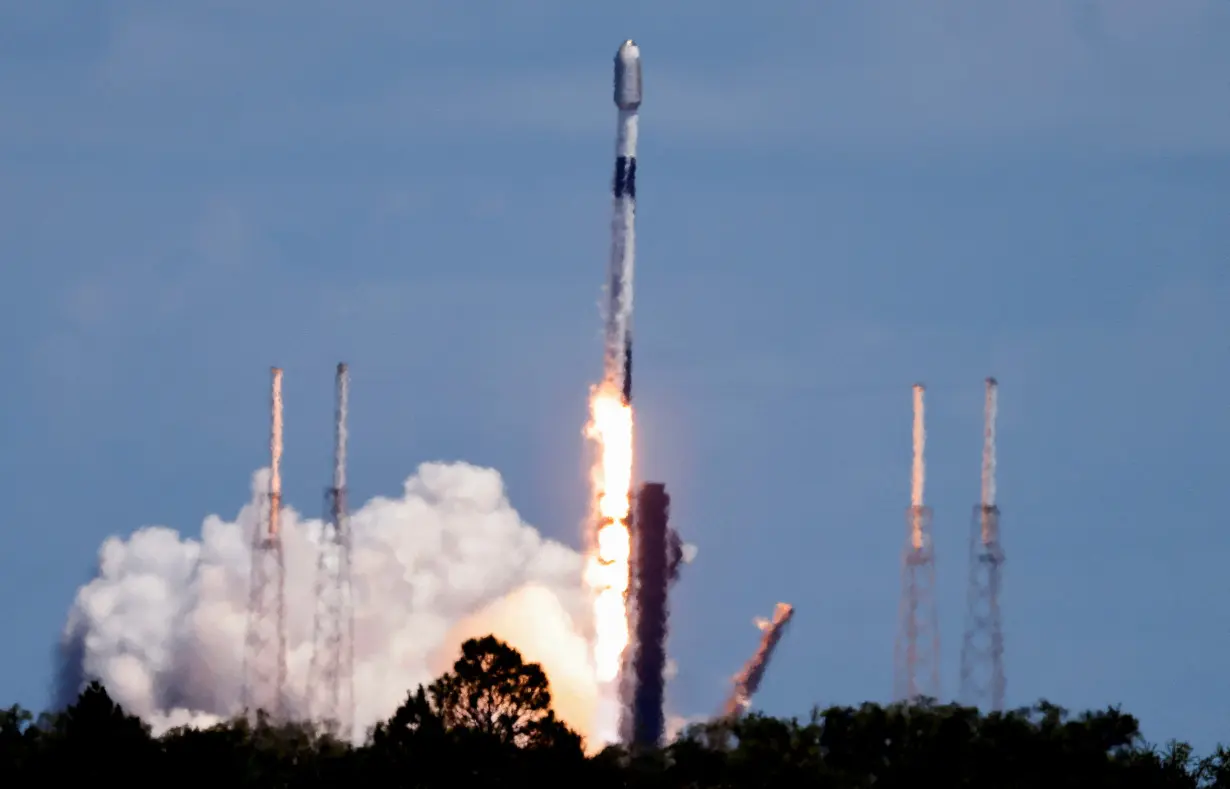 FILE PHOTO: A SpaceX Falcon 9 rocket is launched, carrying 23 Starlink satellites into low Earth orbit