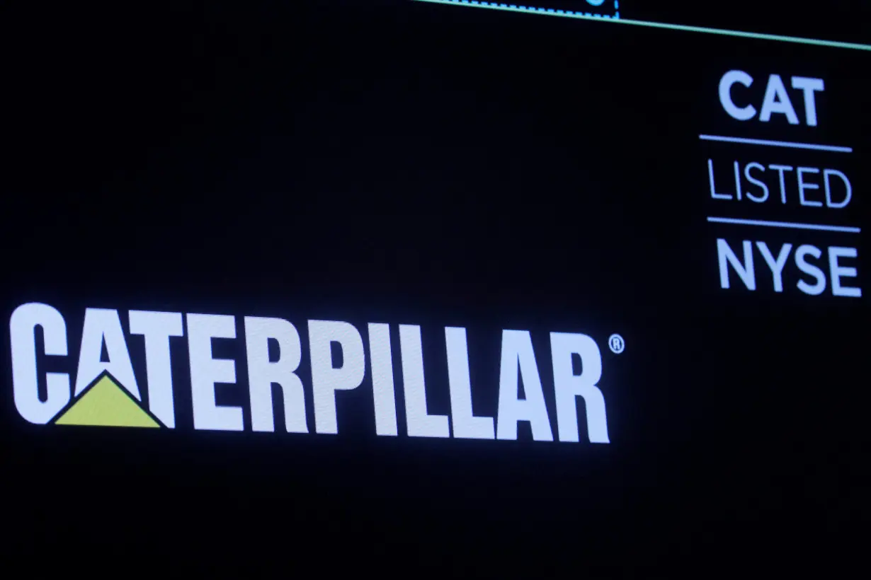 FILE PHOTO: The company logo for Caterpillar Inc. is displayed on a screen at the NYSE in New York