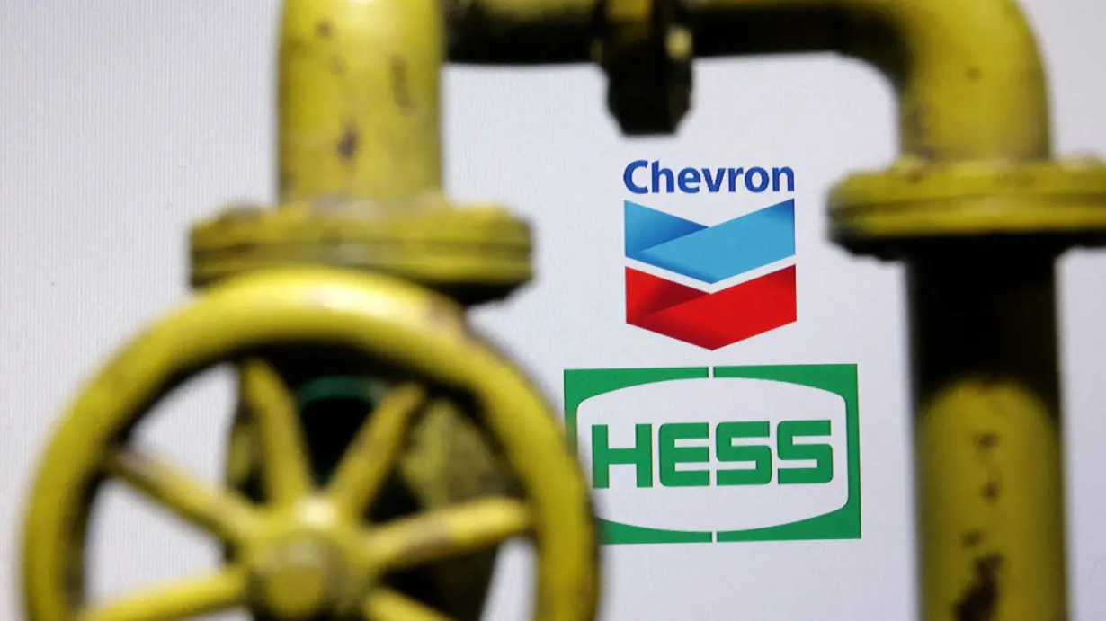 FILE PHOTO: Illustration shows Chevron and Hess logos