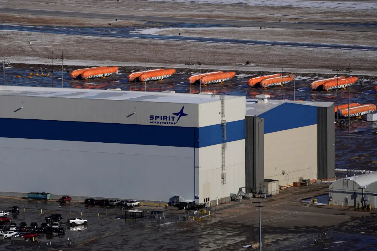 FILE PHOTO: Airplane fuselages bound for Boeing's 737 Max production facility sit in storage behind Spirit AeroSystems Holdings Inc headquarters, in Wichita