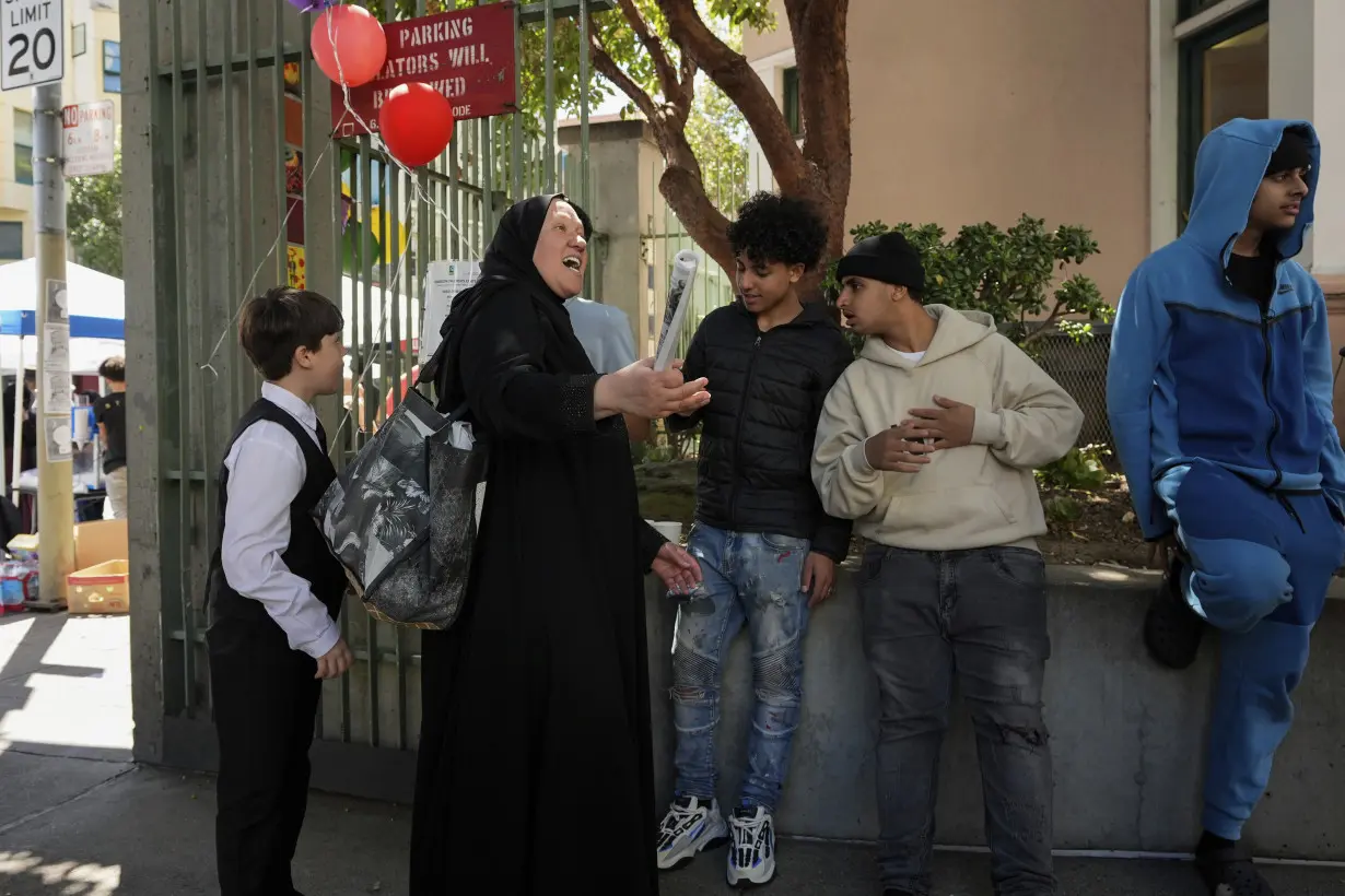 With a vest and a voice, helpers escort kids through San Francisco’s broken Tenderloin streets