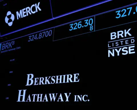 Berkshire pares huge Apple stake as cash, operating profit set records