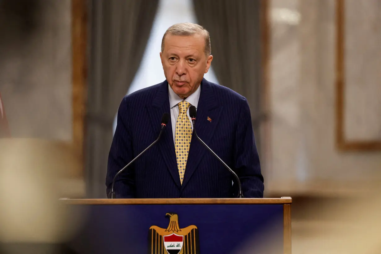 FILE PHOTO: Turkish President Tayyip Erdogan attends a press conference during his visit, in Baghdad