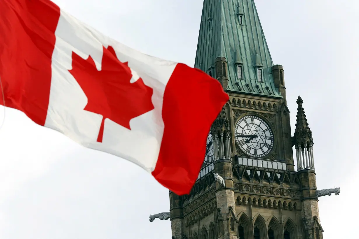 FILE PHOTO: The Canadian flag flies on Parliament Hill in Ottawa