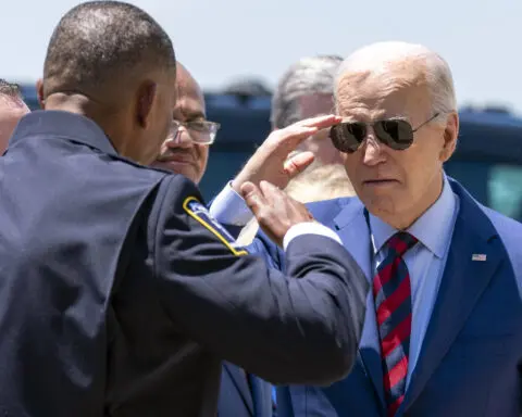 Biden, after meeting with families of officers killed in NC, says the nation is grieving with them