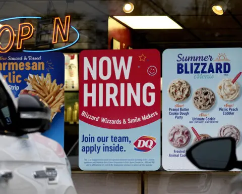 US applications for jobless benefits come back down after last week's 9-month high