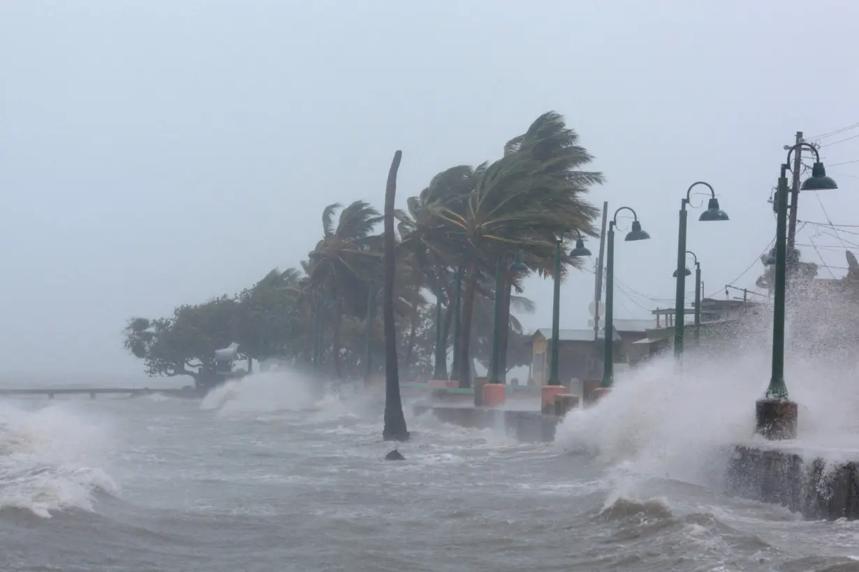 FILE PHOTO: Waves crash against the seawall in Fajardo as Hurricane Irma slammed across islands in the northern Caribbean