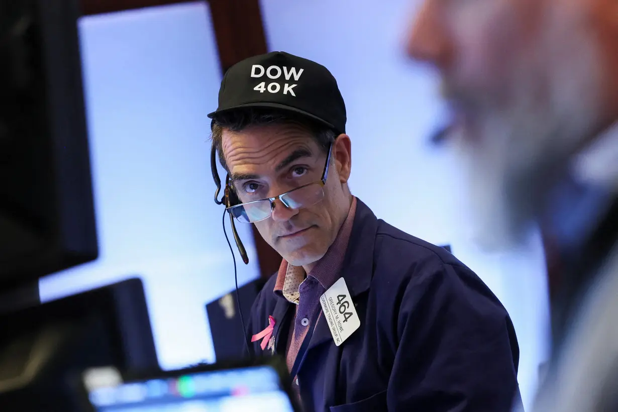 Traders work on the floor at the New York Stock Exchange (NYSE) in New York City