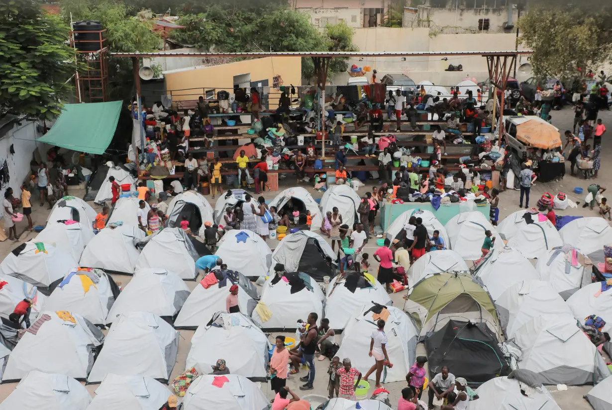 FILE PHOTO: Haitians fleeing gang violence find shelter in a sport arena, in Port-au-Prince