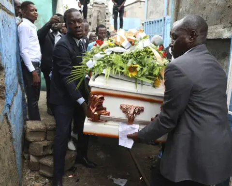 Hundreds mourn gang killings of a Haitian mission director and a young American couple