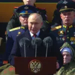 Putin says on Victory Day that Russia won't let anyone threaten it