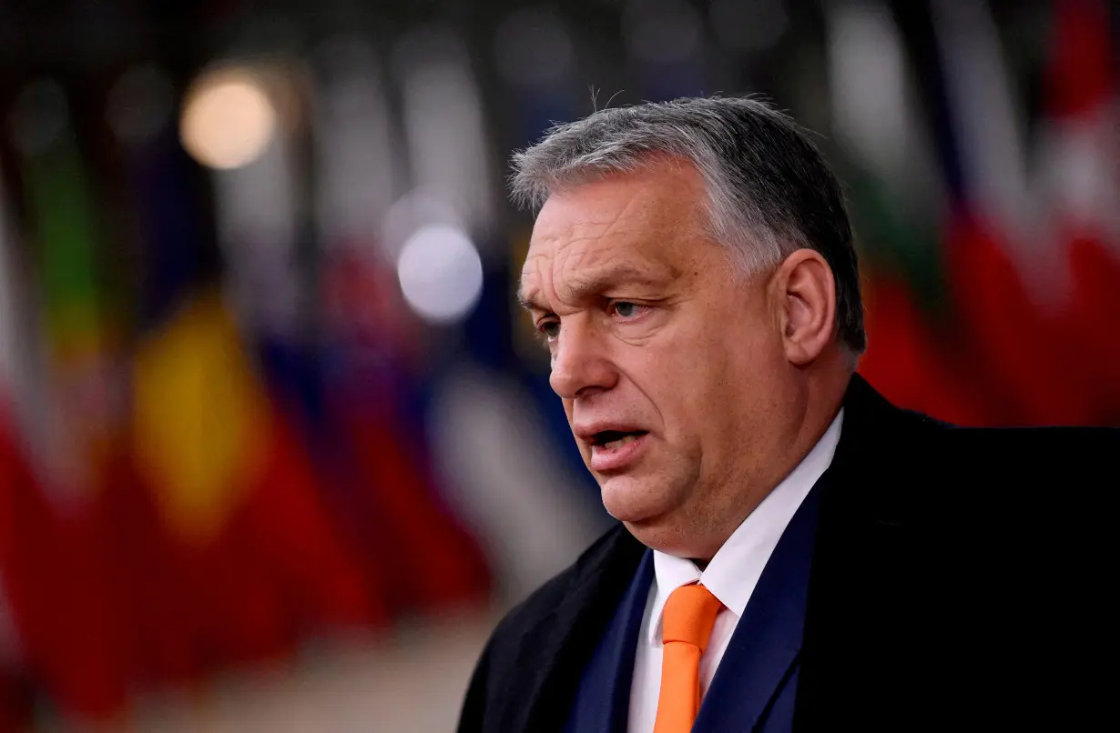 FILE PHOTO: FILE PHOTO: Hungarian Prime Minister Viktor Orban speaks on arrival for an EU summit in Brussels