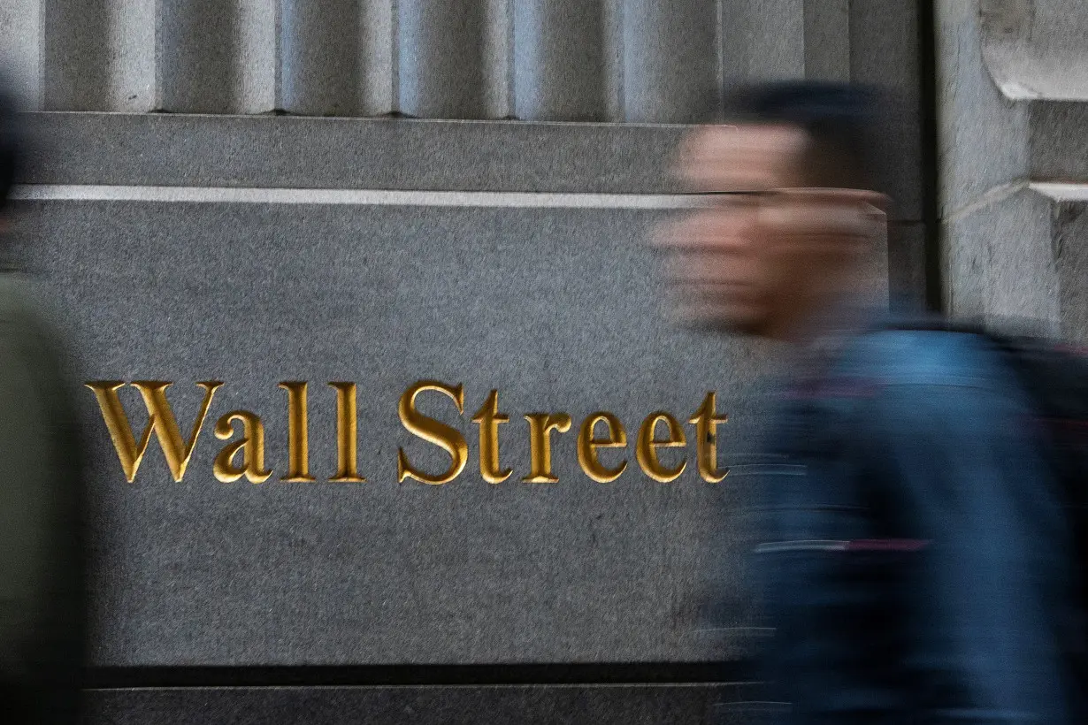 Wall Street ends slightly lower, capping blockbuster year